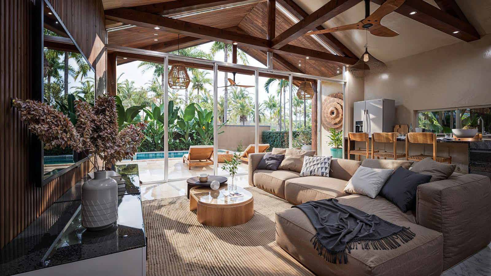 Living room beneath a timber roof, opening onto the garden
